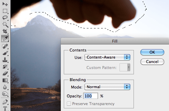 photoshop processing to remove a hand from a photograph