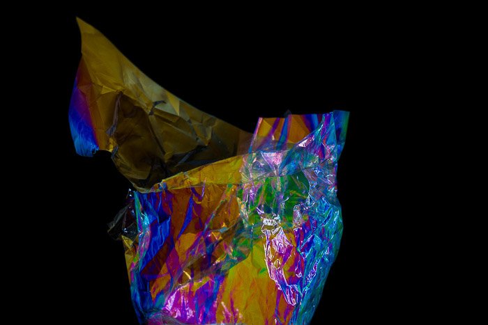 Food wrapper showing abstract color effects from photoelasticity 