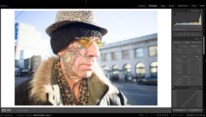 editing street photography - original photo of a old with a colourful face tattoo and eccentric clothes