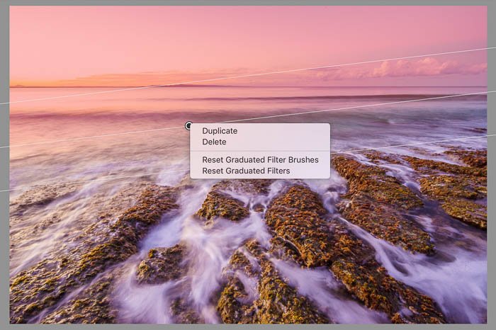 Скриншот редактирования прибрежного пейзажа с помощью дублирующих фильтров Lightroom
