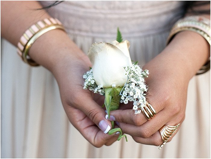 prom picture poses- close up of the teen girl holding a corsage flower