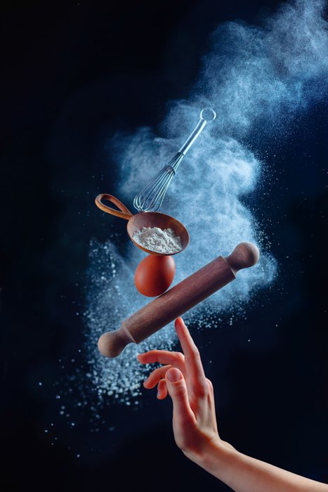Amazing still life shot using flying kitchen utensils and flour clouds - creative still life photography