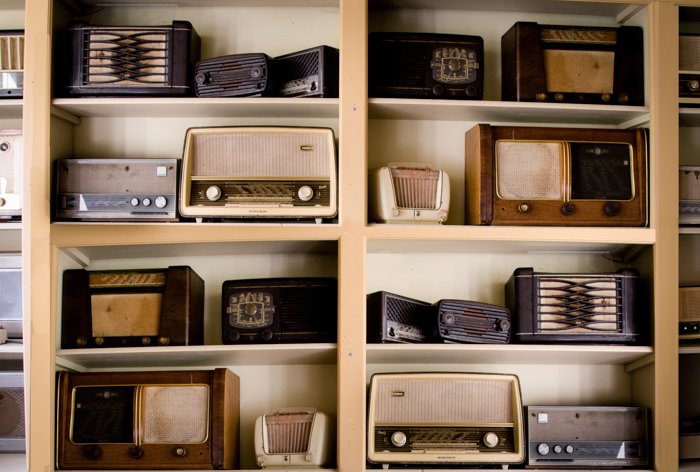 A shelving unite displaying many vintage radio sets - bad types of stock photos