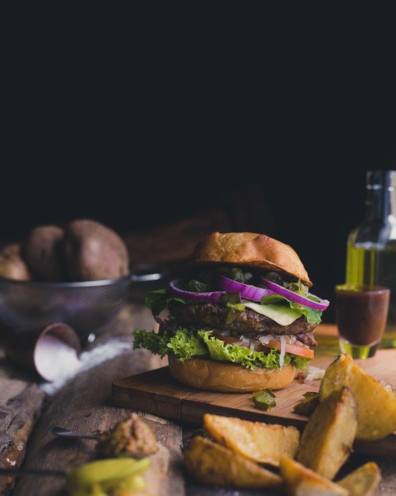 Dark and moody food portrait of a hamburger - food photography examples