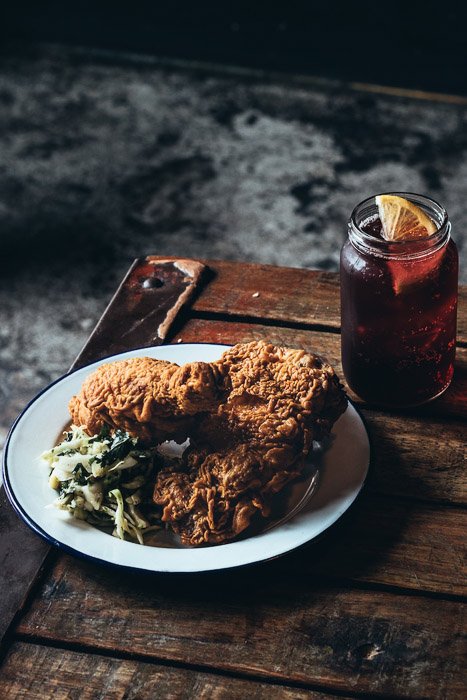 A rustic shot of breaded meat on the wooden board - food photography examples