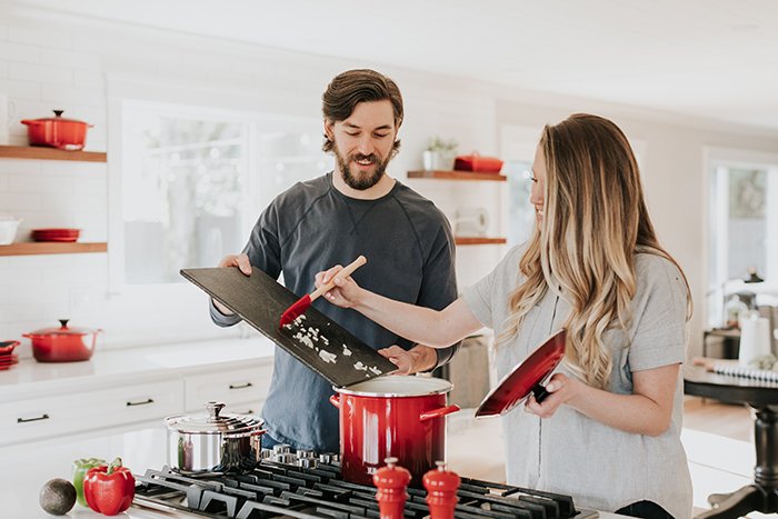 Casual lifestyle portrait of the couple cooking together