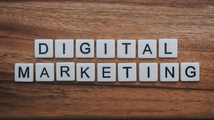 a flatlay of scrabble letters reading 'digital marketing' - photography marketing mistakes