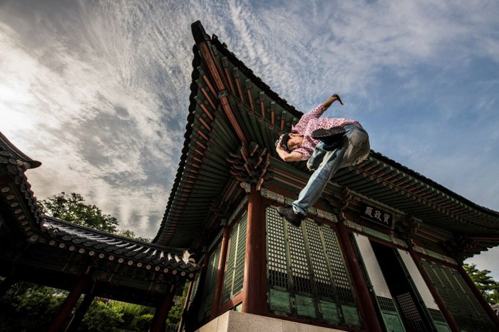 Stunning action portrait of the man doing flying kick shot with Profoto b10 flash