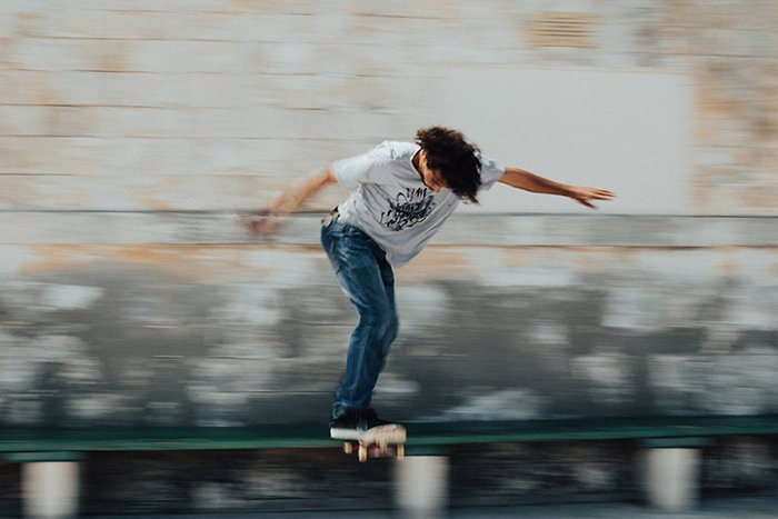 Motion blur photo of the man skateboarding