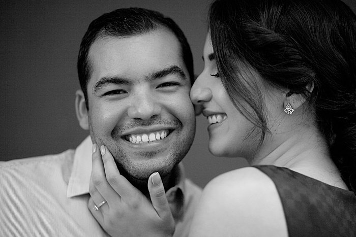 Close up black and white portrait of the couple smiling