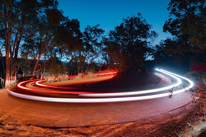 cool long exposure time lapse of light trails spinning around a roundabout