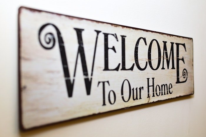 A 'Welcome to Our Home' wall-sign
