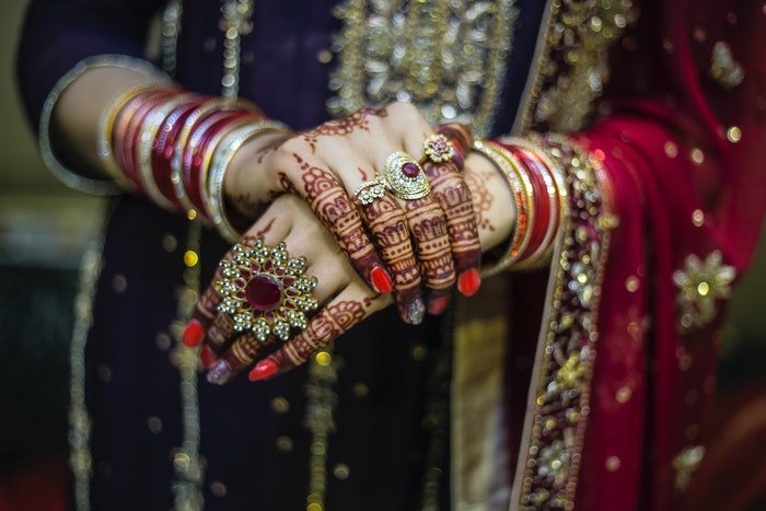 Close up of an Indian bride getting ready for her wedding