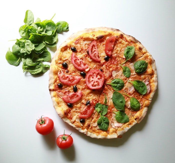 Flat lay food photo of the pizza plus extra ingredients