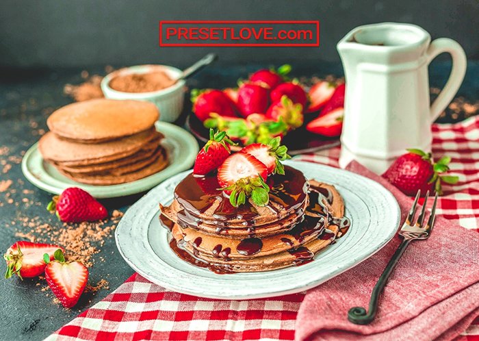 Image of pancakes with strawberries and syrup edited with PresetLove free lightroom Presets