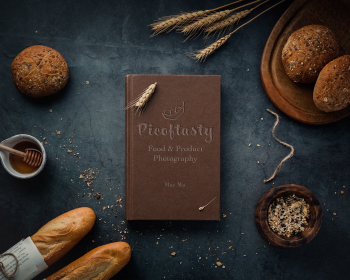Накладная фотография товара изображение кулинарной книги на столе с хлебом и пшеницей