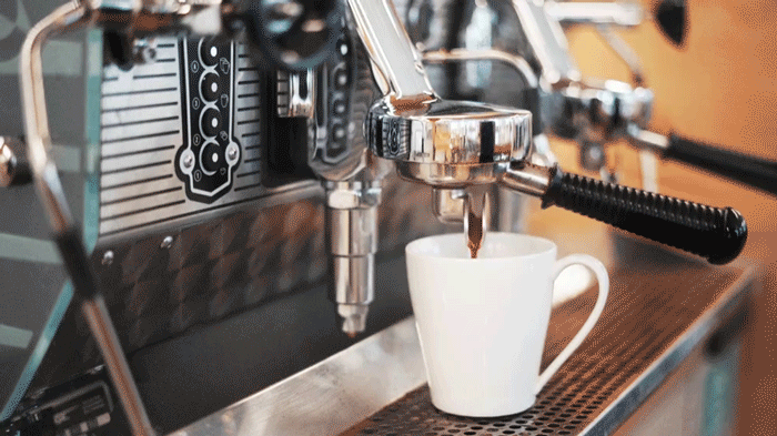 cinemagraph of the coffee machine filling a cup of coffee