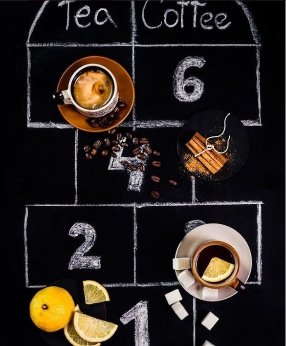 flat lay background idea: coffee and tea in mugs against the chalk board backdrop