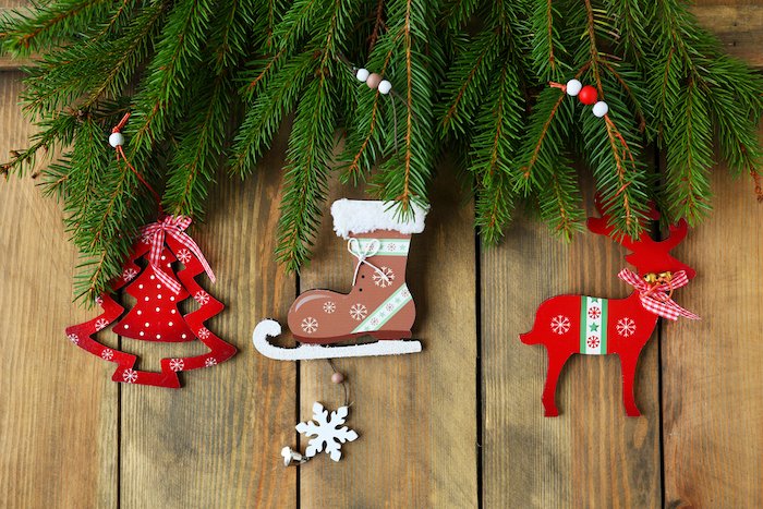 Christmas flat lay of vintage tree skate and reindeer decorations on the wood panel floor
