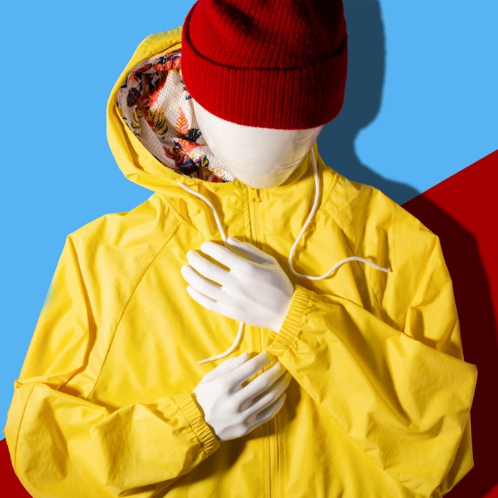 Flat Lay Photography for Clothing: A flat lay image of the raincoat and cap on mannequin