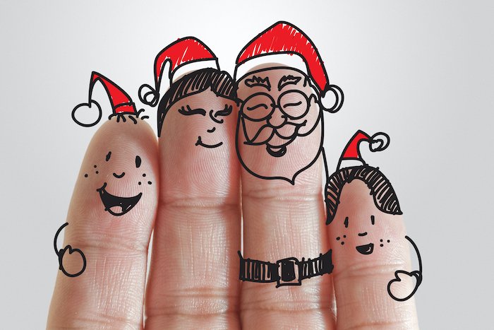Пальцы с лицами и шапки Санты для рождественских открыток фото идеи