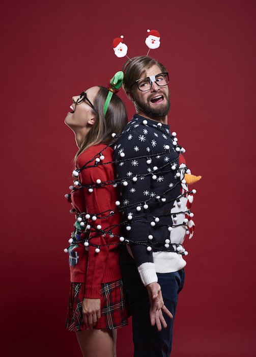 Couple wrapped in lights for Christmas photo ideas