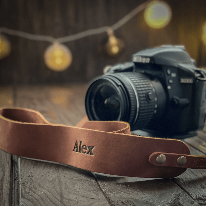 Custom leather camera strap with a person's name for photo gift ideas