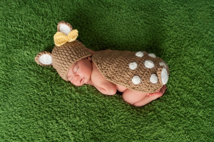 Baby girl in the deer costume as newborn photo idea